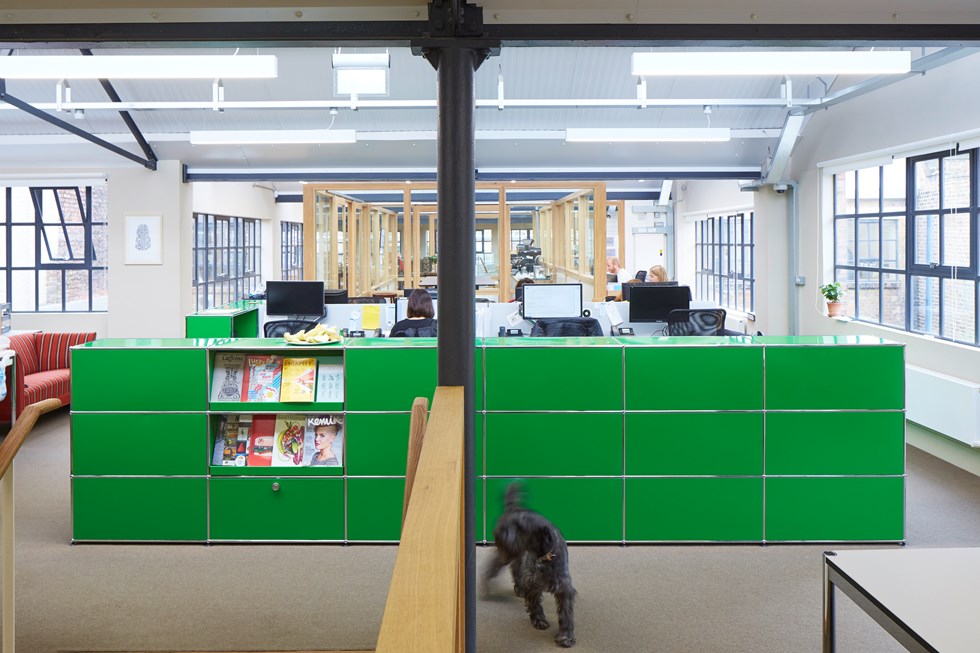 modern office design with green USM Haller furniture