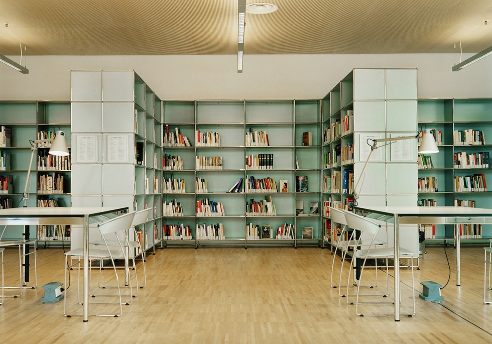 USM Haller grey bookshelves in library