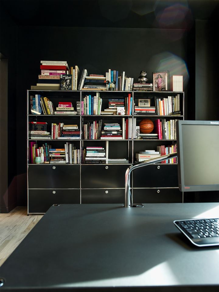 Black USM haller modular bookshelves and cabinets in an executive office