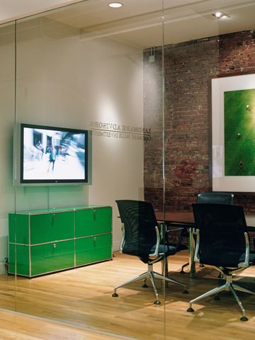 green and chrome USM haller media unit with storage lockers in a board room