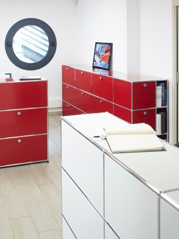 elegant designer office furniture in USM Haller ruby red and pure white