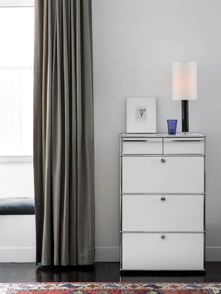 USM Haller dresser in white in a modern bedroom