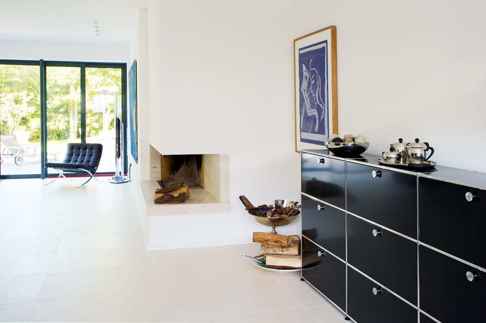 graphite black sideboard storage in an all white livingroom