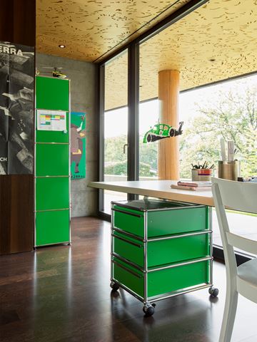 green usm pedestal and storage shelves in a childrens rooms 