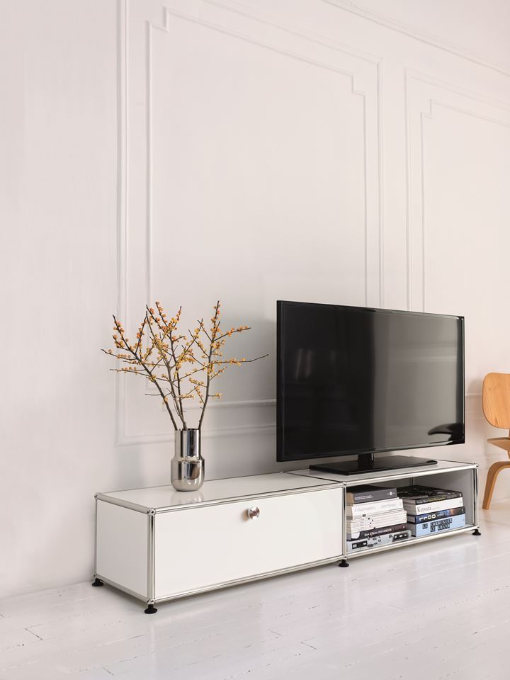white USM tv unit and storage in a contemporary white living room