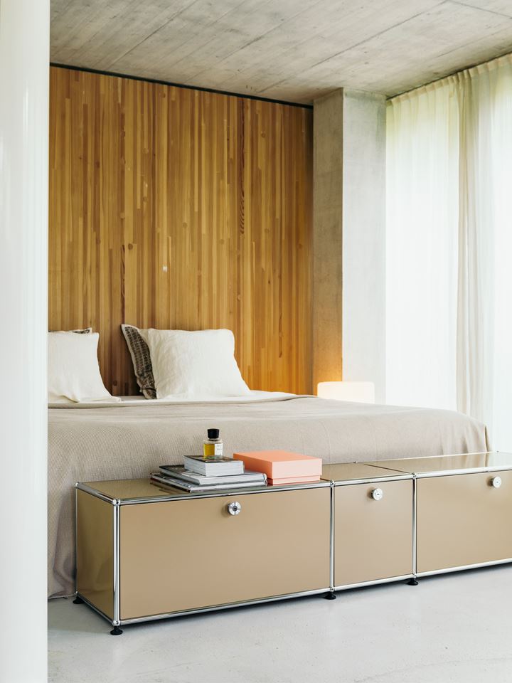 beige metal USM Haller sideboard in a bedroom