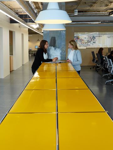 yellow USM Haller solutions with storage cabinets in a office