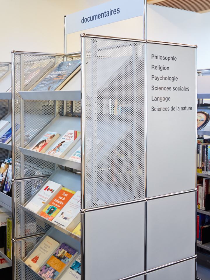 USM Haller double sided shelving with signage