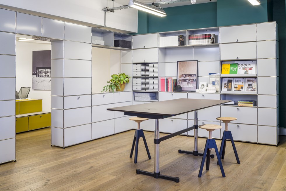 modern open plan office with white modular furniture and desks