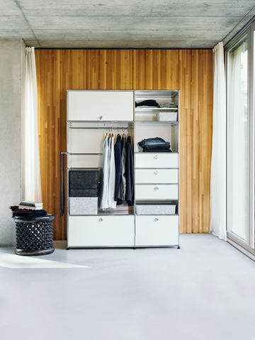 USM haller wardrobe in a pure white morden bedroom with wooden wall